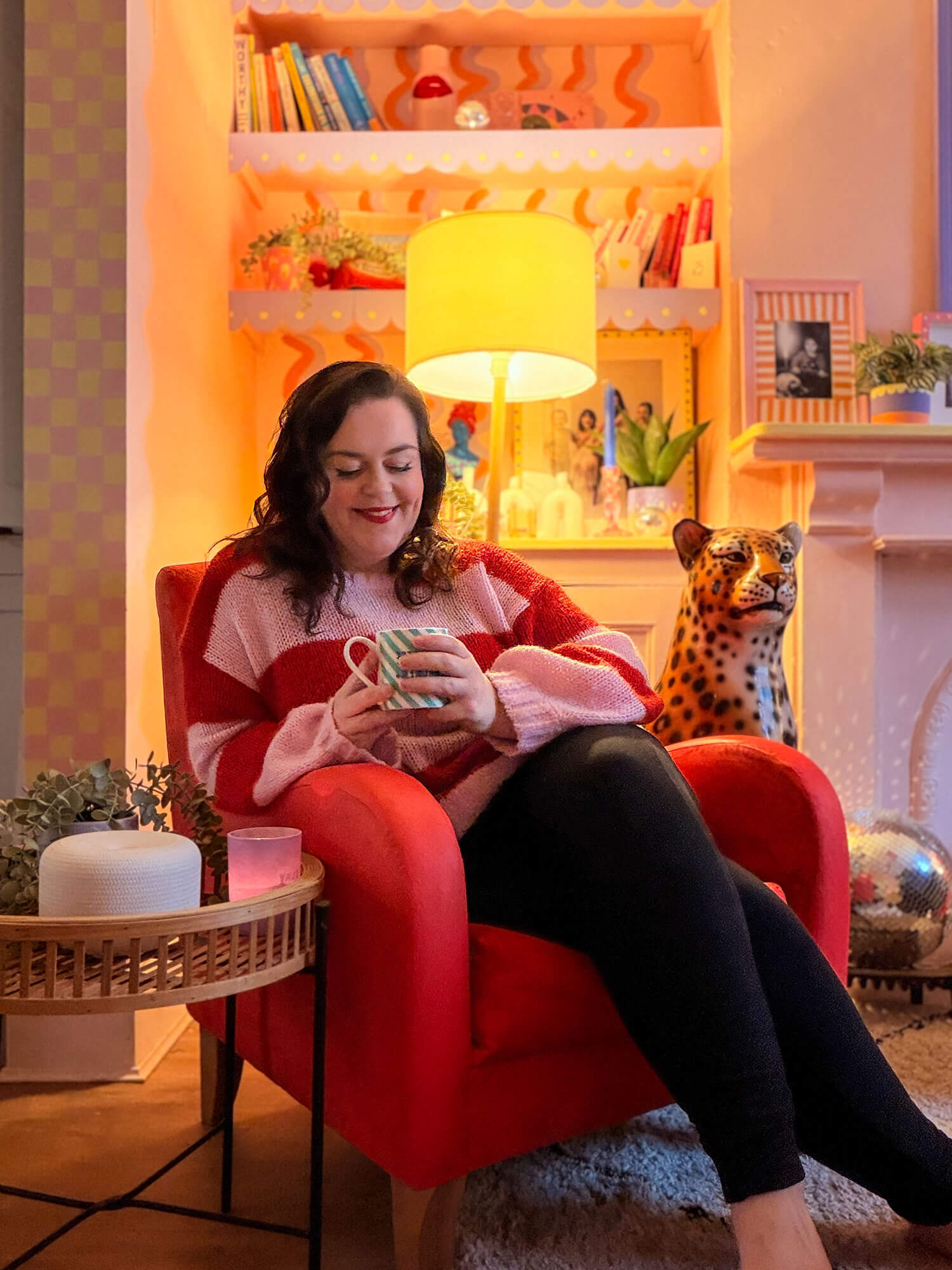 A woman relaxing in a cosy living room, sitting in a red armchair with a warm drink, enjoying a quiet moment of self care. Soft lighting, colourful décor and a comforting atmosphere highlight simple self care ideas for unwinding at home.A woman relaxing in a cosy living room, sitting in a red armchair with a warm drink, enjoying a quiet moment of self care. Soft lighting, colourful décor and a comforting atmosphere highlight simple self care ideas for unwinding at home.A woman relaxing in a cosy living room, sitting in a red armchair with a warm drink, enjoying a quiet moment of self care. Soft lighting, colourful décor and a comforting atmosphere highlight simple self care ideas for unwinding at home.