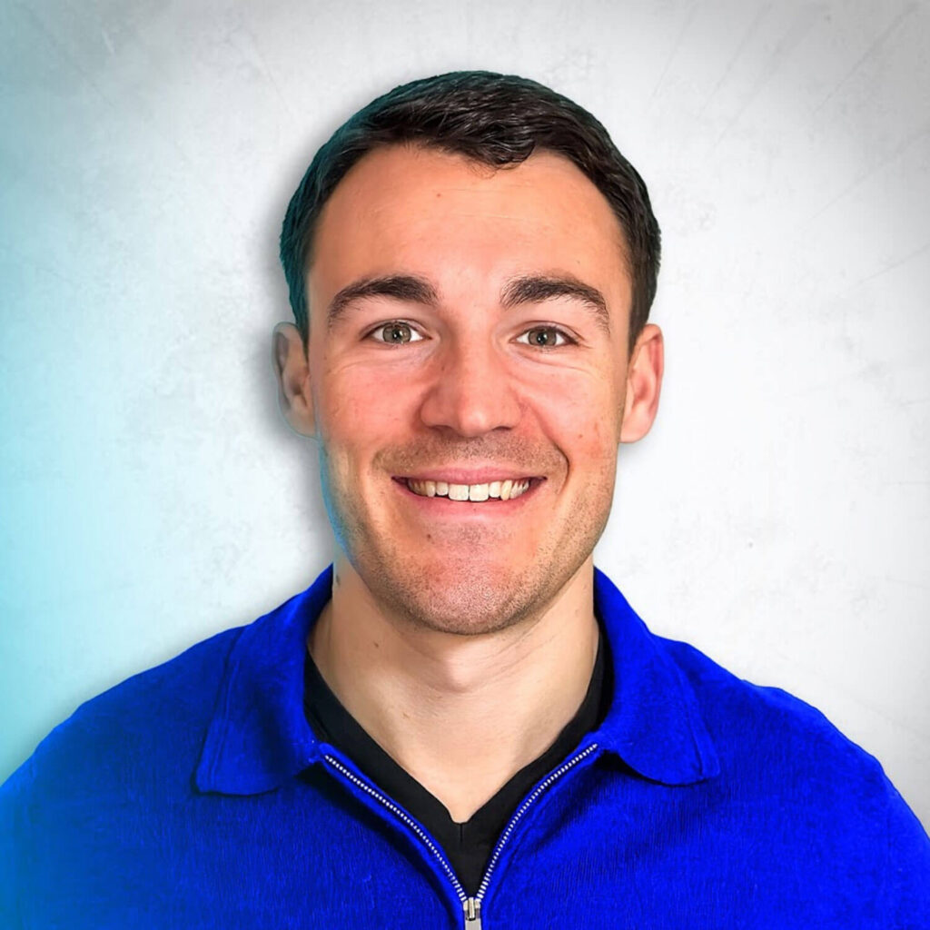 photo of facebook ads course creator ben heath wearing a blue shirt and smiling at the camera