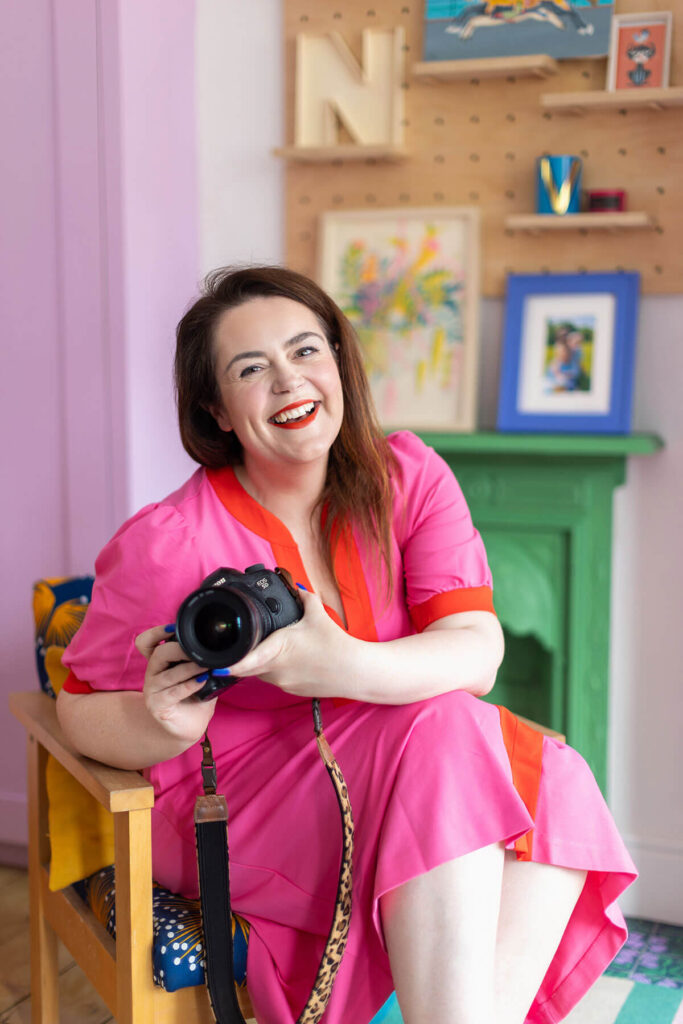Female entrepreneur and personal brand photographer Rosie Parsons in her colourful home studio in Exeter