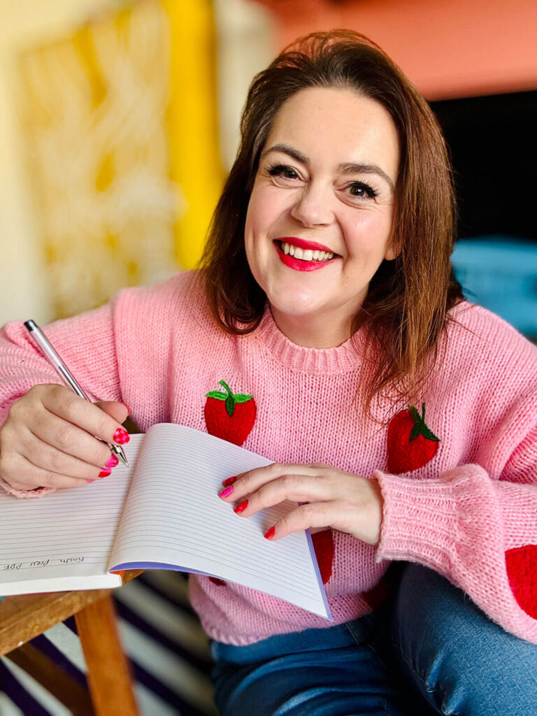 Behind-the-scenes showing a brand photographer planning a photo shoot and shot list